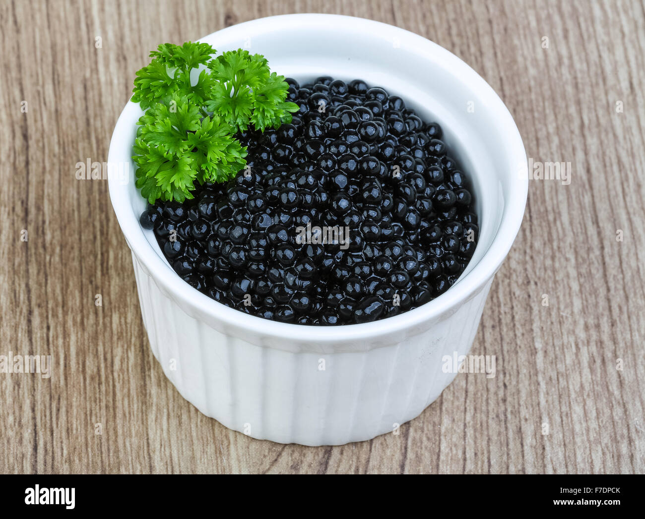 Luxury Black caviar in the bowl with parsley leaves Stock Photo Alamy
