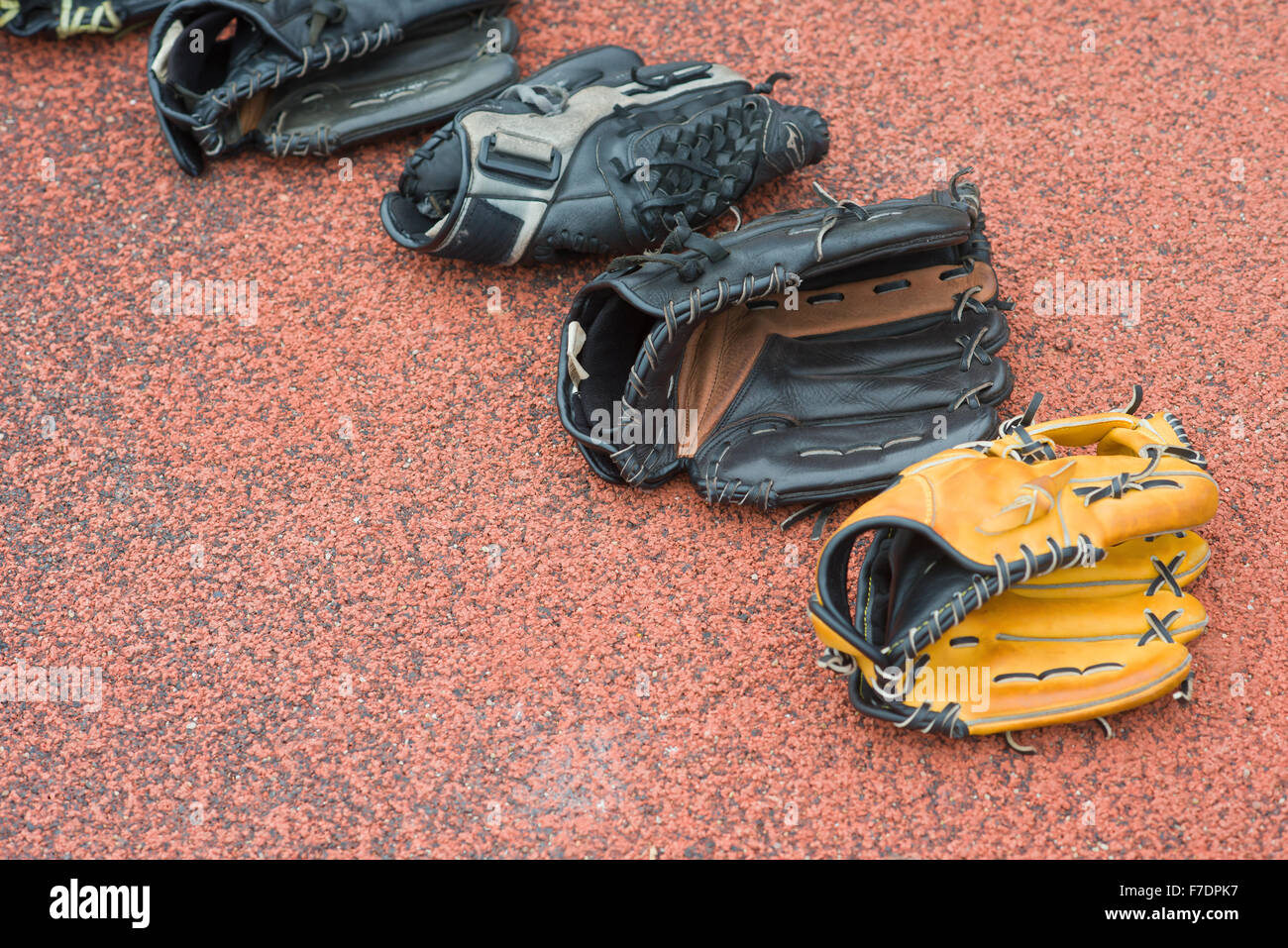 baseball gloves on a rubber background Stock Photo Alamy