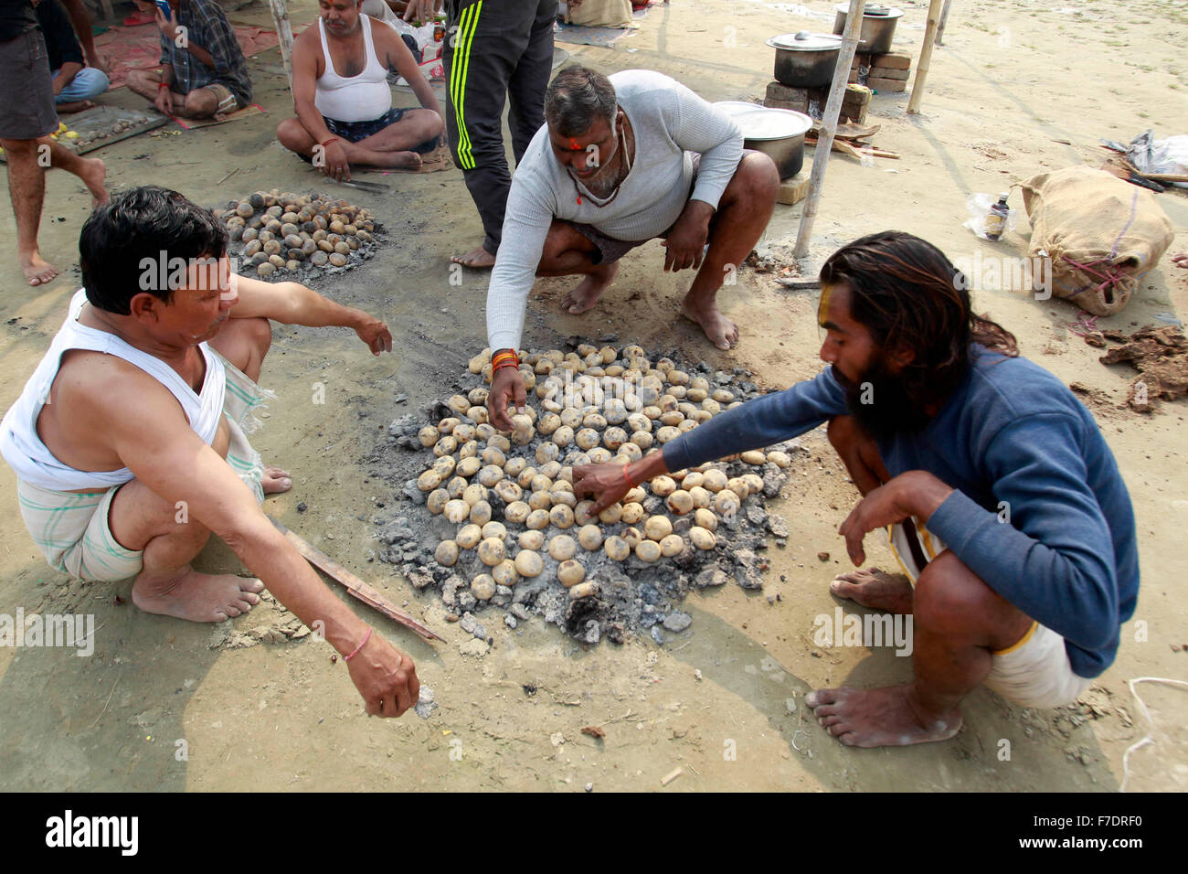 Allahabad, India. 29th Nov, 2015. Hindu devotees preparing Bati (roti ...