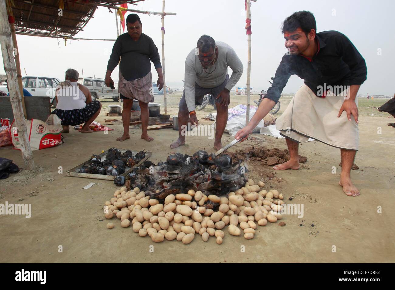 Allahabad, India. 29th Nov, 2015. Hindu devotees preparing Bati (roti ...