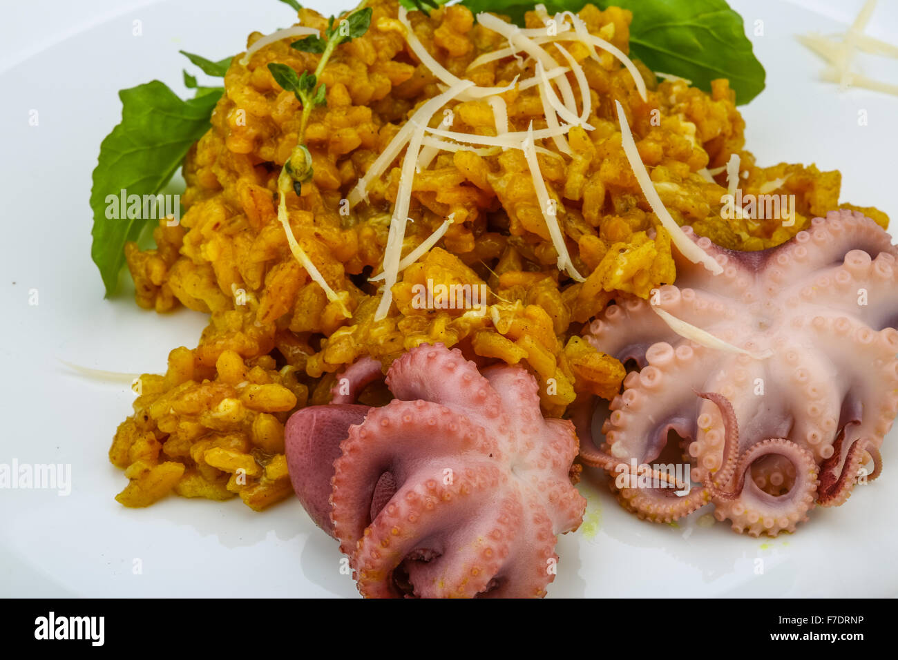 Seafood risotto with octopus, cheese and thyme leaf Stock Photo Alamy