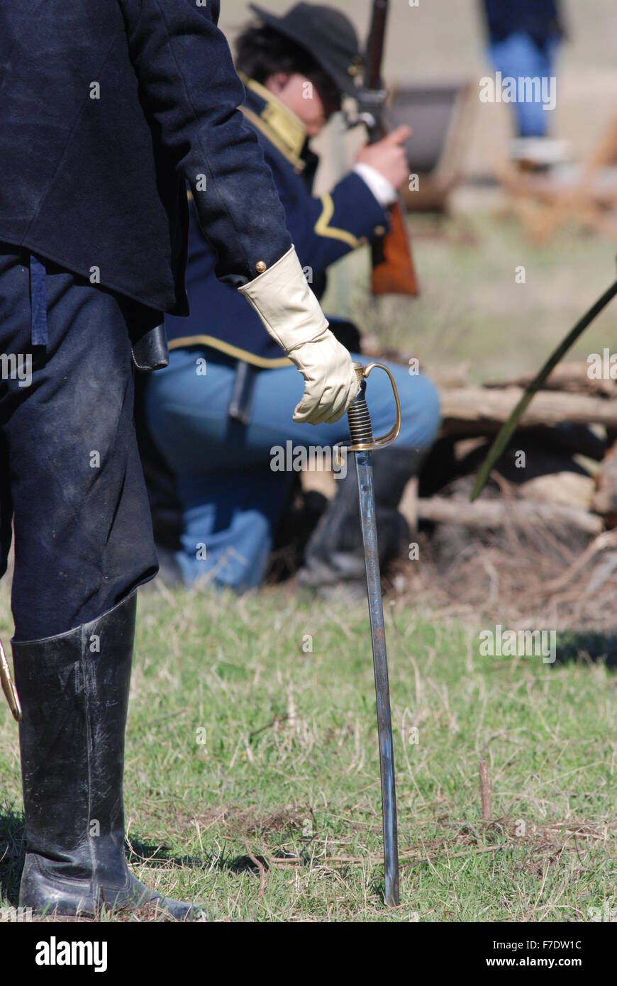 Saber of a U.S. Civil War actor at a re-enactment show stuck in the ground. Stock Photo