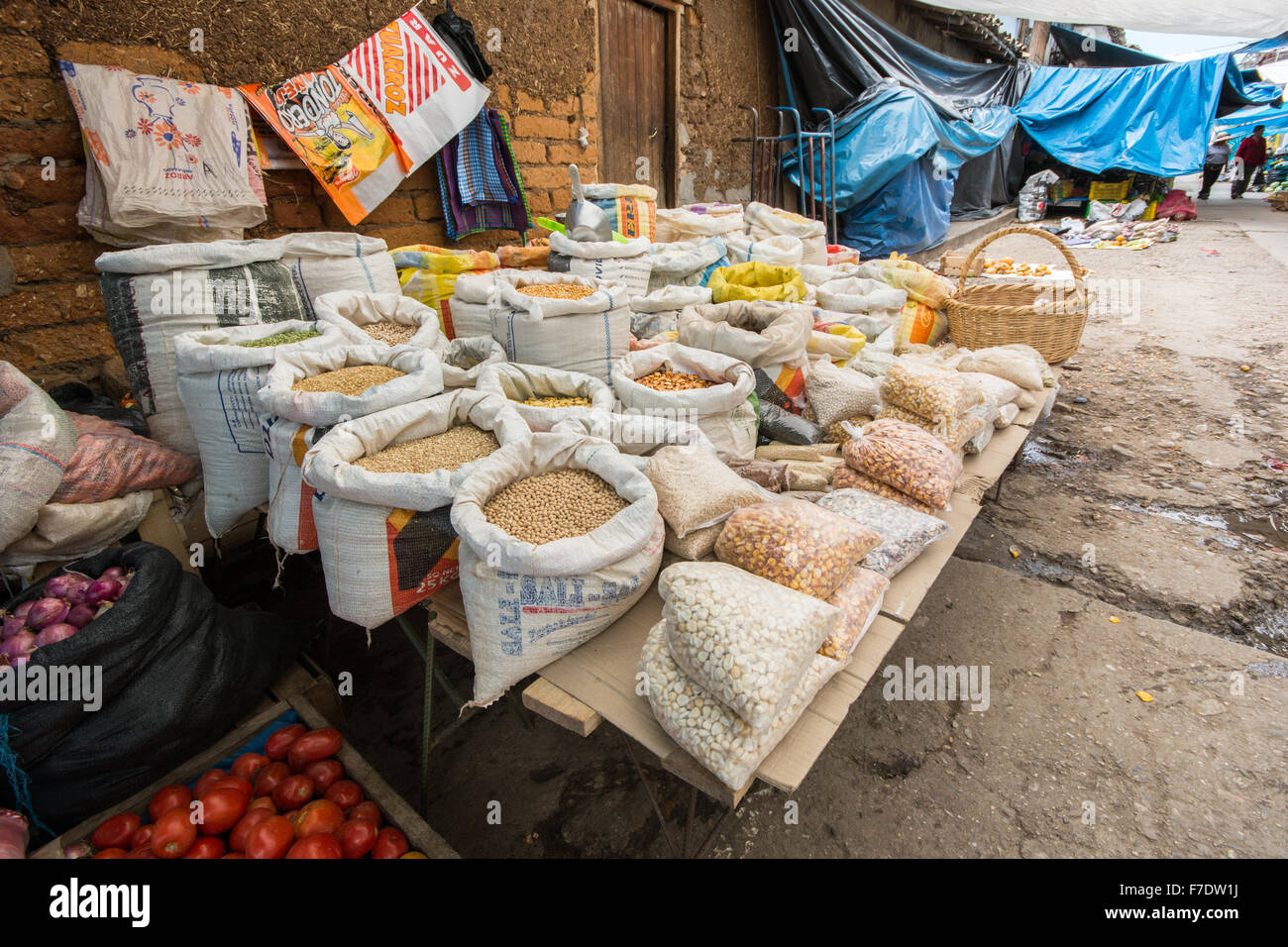 Sacks of grain, corn and beans on sale at Peruvian street market in