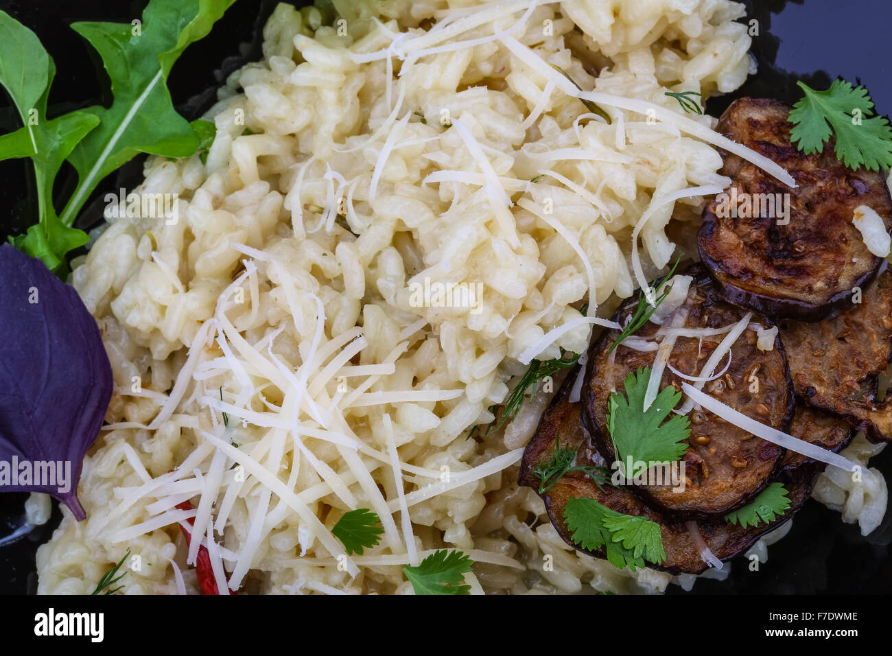 Italian trditional Risotto with eggplant and coriander Stock Photo Alamy