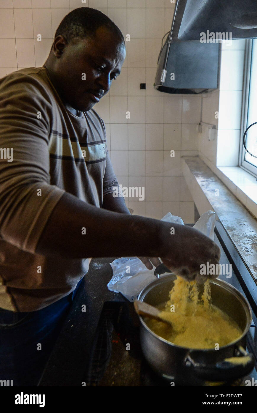 Changchun, China's Jilin Province. 27th Nov, 2015. Ramazani Nashiri, a medical student from Burundi, makes traditional Burundian food at his dorm room in Changchun, capital of northeast China's Jilin Province, Nov. 27, 2015. Nashiri, 40, has lived in China for nine years to study gynecology and obstetrics. He now is a PhD student at the Norman Bethune Health Science Center of Jilin University. A total of 528 foreign students studied medicine at the center, most of whom come from Asia and African nations. © Wang Haofei/Xinhua/Alamy Live News Stock Photo