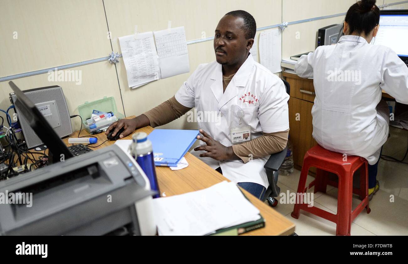 Changchun, China's Jilin Province. 27th Nov, 2015. Ramazani Nashiri, a medical student from Burundi, reviews patients' medical records at the First Hospital of Jilin University in Changchun, capital of northeast China's Jilin Province, Nov. 27, 2015. Nashiri, 40, has lived in China for nine years to study gynecology and obstetrics. He now is a PhD student at the Norman Bethune Health Science Center of Jilin University. A total of 528 foreign students studied medicine at the center, most of whom come from Asia and African nations. © Wang Haofei/Xinhua/Alamy Live News Stock Photo