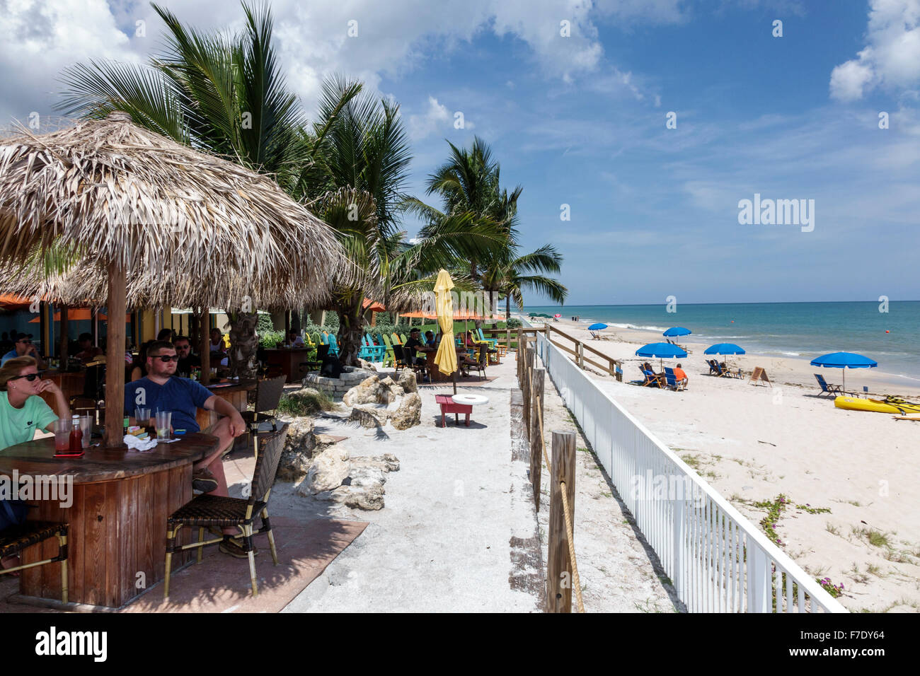 Vero Beach Florida,North Hutchinson Orchid Island,Mulligan's Beach House,restaurant restaurants food dining cafe cafes,tiki style umbrella,al fresco d Stock Photo