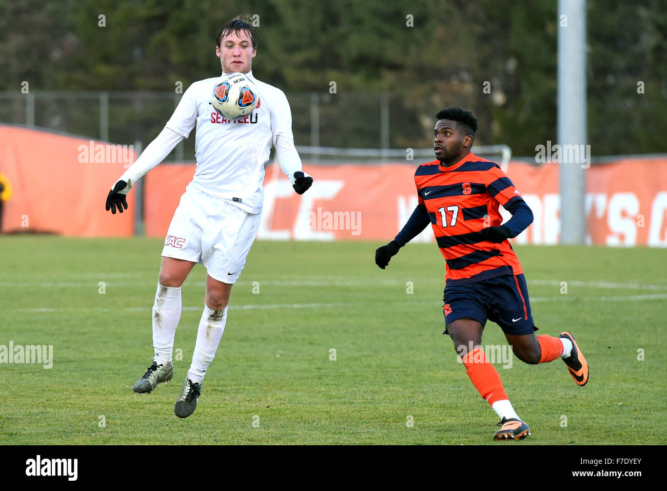 Syracuse, New York, USA. 29th Nov, 2015. Seattle Redhawks midfielder  Cameron Rohani (15) leaps to control a loose ball as Syracuse Orange  forward Chris Nanco (17) defends during the second half of, image size:1300x956