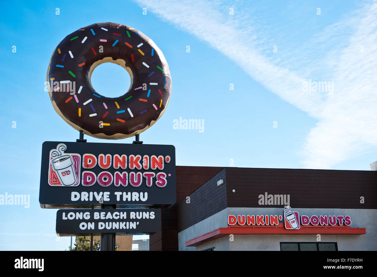 Dunkin' Donuts with a large donut on top of sign Stock Photo