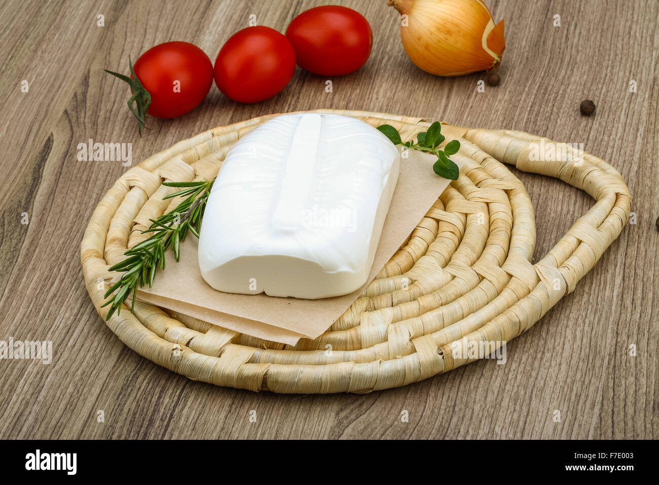 Traditional Greek cheese - Feta with herbs on the wood background Stock ...