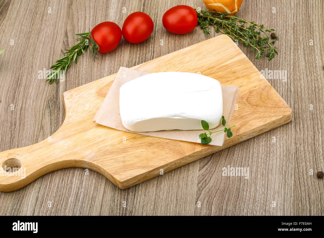 Traditional Greek cheese - Feta with herbs on the wood background Stock ...