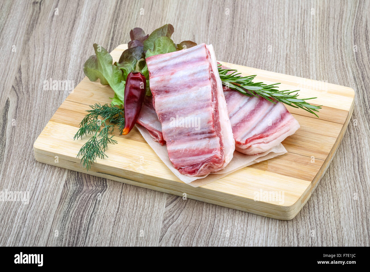 Fresh cold Raw lamb ribs with garlik and pepper - ready for cooking ...