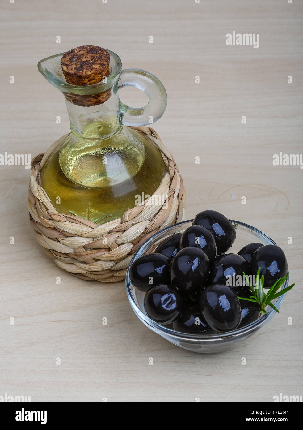 Olive oil with berries on the wood background Stock Photo Alamy