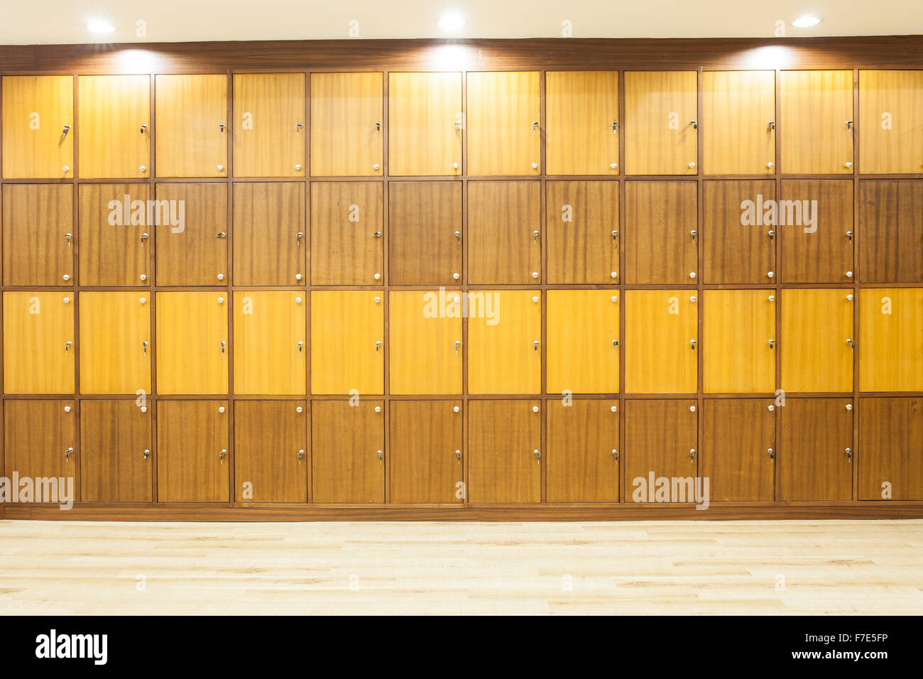 Modern wood Interior of a locker with lighting on top. Stock Photo