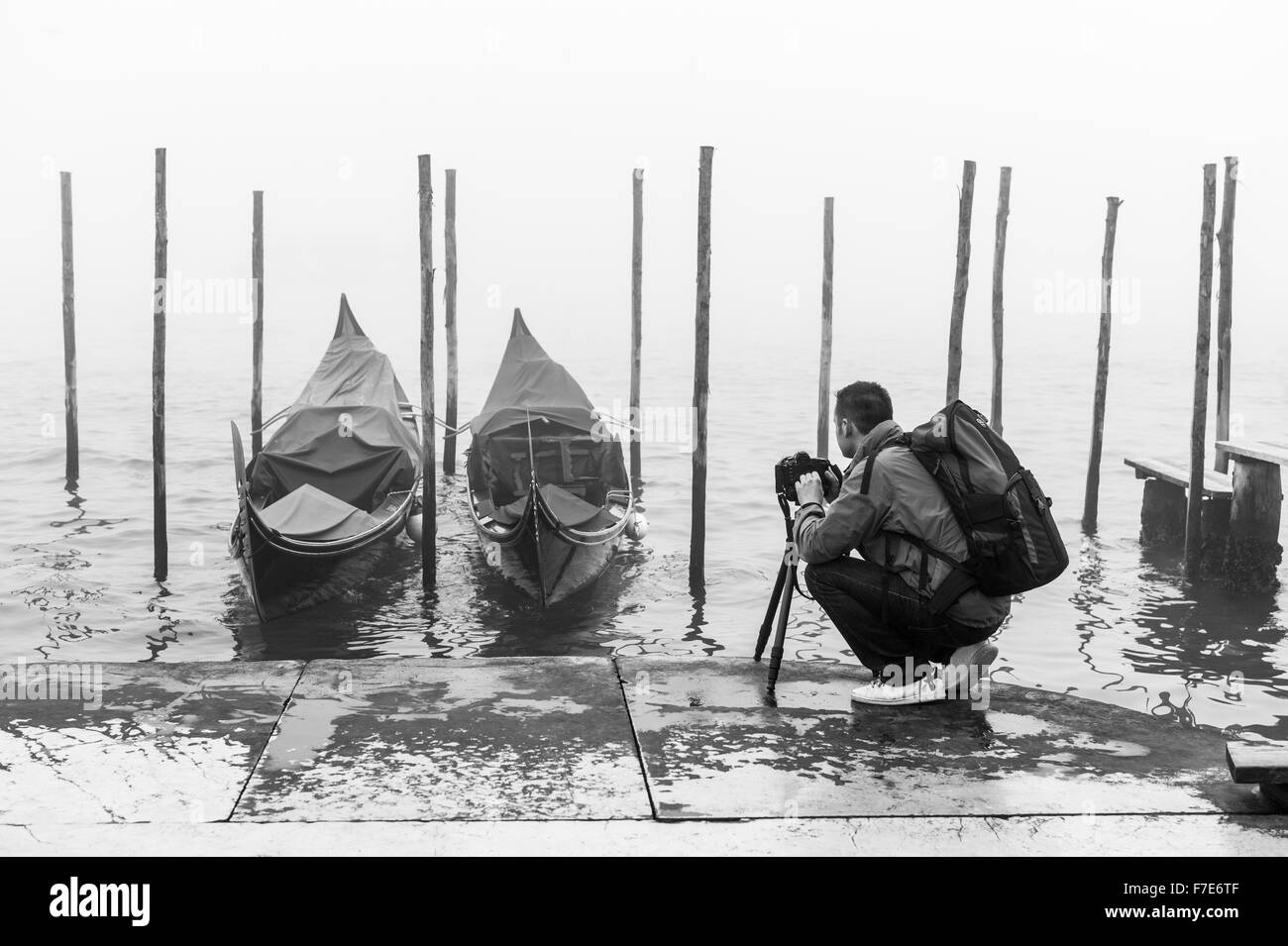 Italy, Venice, a photographer in Riva Degli Schiavoni in a foggy day Stock Photo