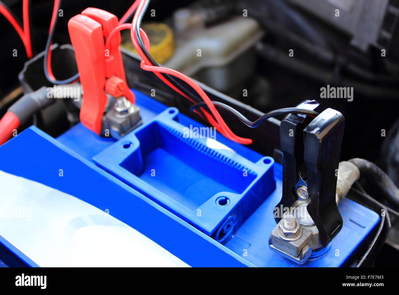 Charger with cables uses to charge old dead car battery Stock Photo Alamy