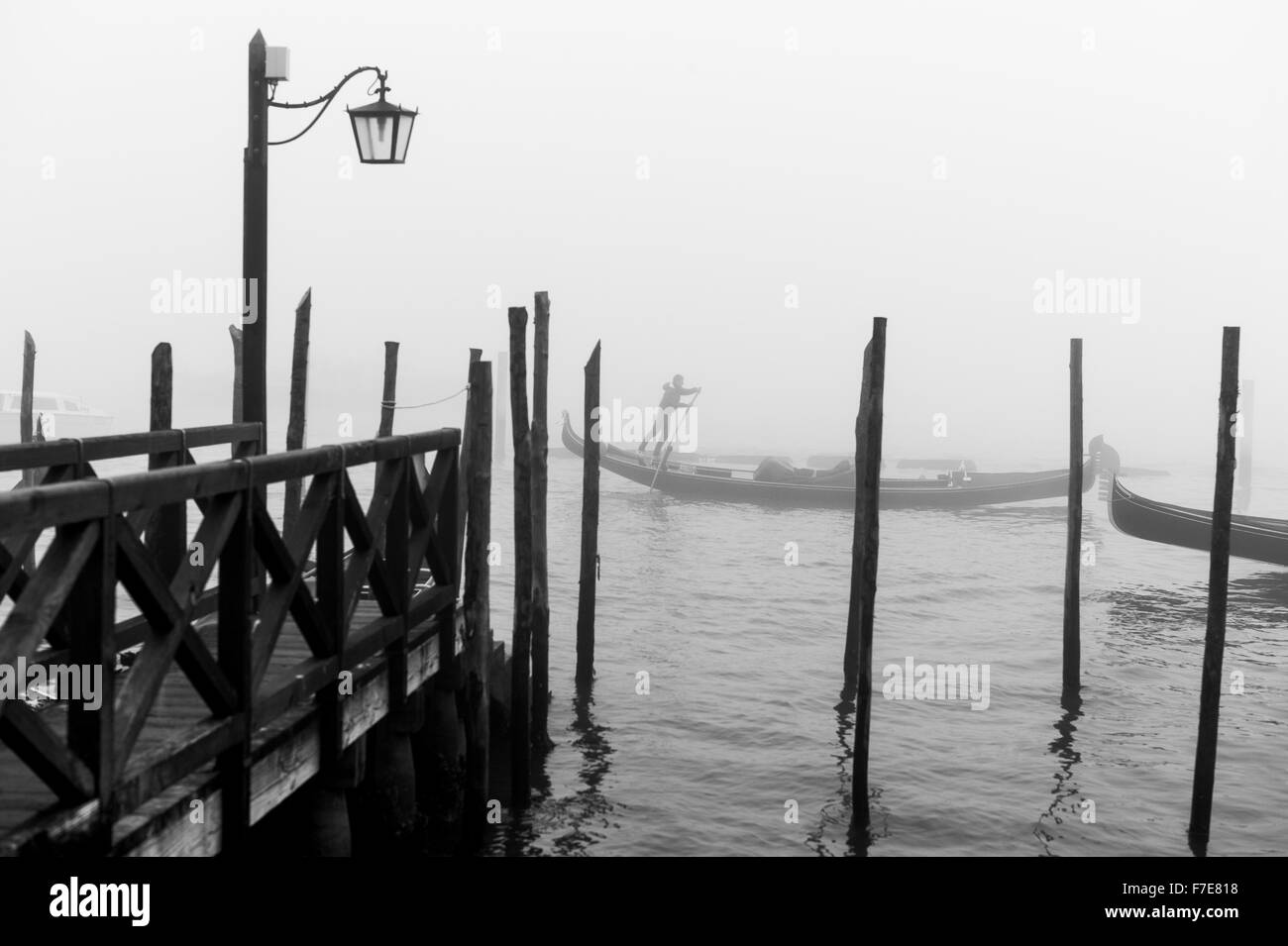 Italy, Venice, a gondolier near Riva Degli Schiavoni in a foggy day Stock Photo