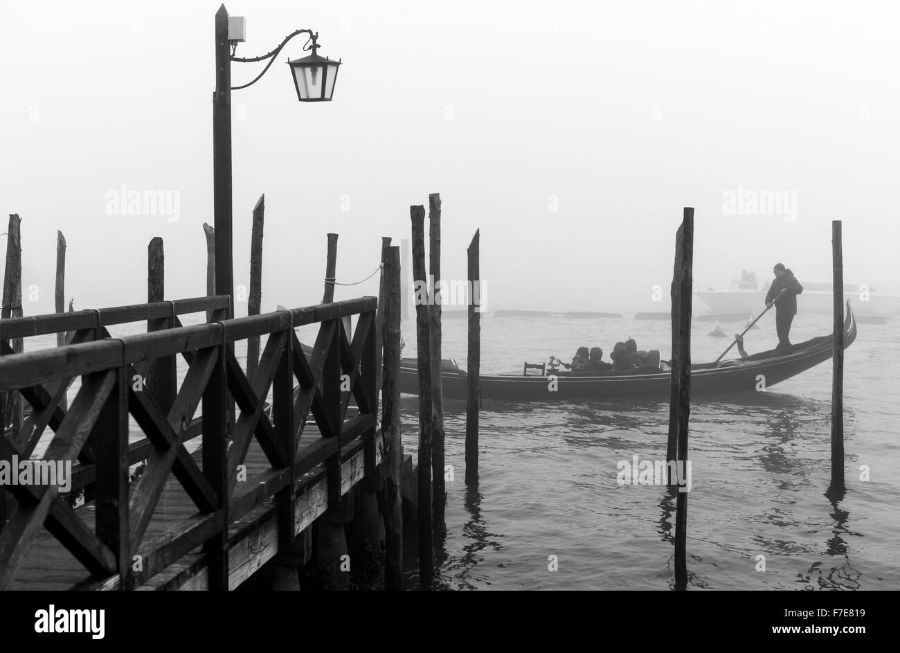 Italy, Venice, a gondolier near Riva Degli Schiavoni in a foggy day Stock Photo