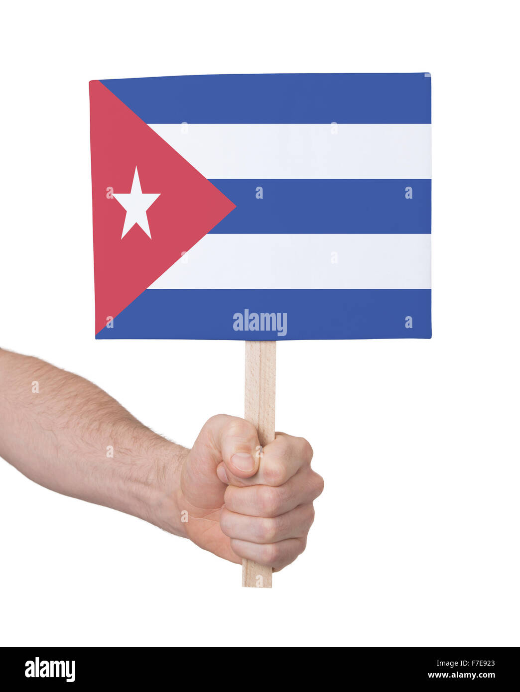 Hand holding small card, isolated on white - Flag of Cuba Stock Photo