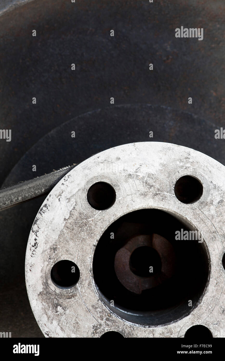 flywheel with belt abstract background or part of vintage mechanism Stock Photo
