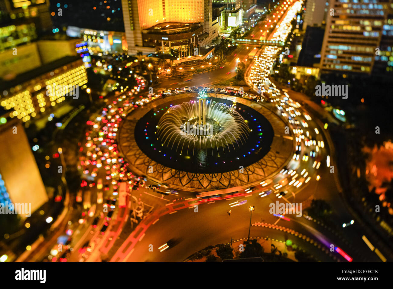 Indonesia, Jakarta, Hotel Indonesia roundabout, Welcome Monument and buildings along Jalan Thamrin at night Stock Photo