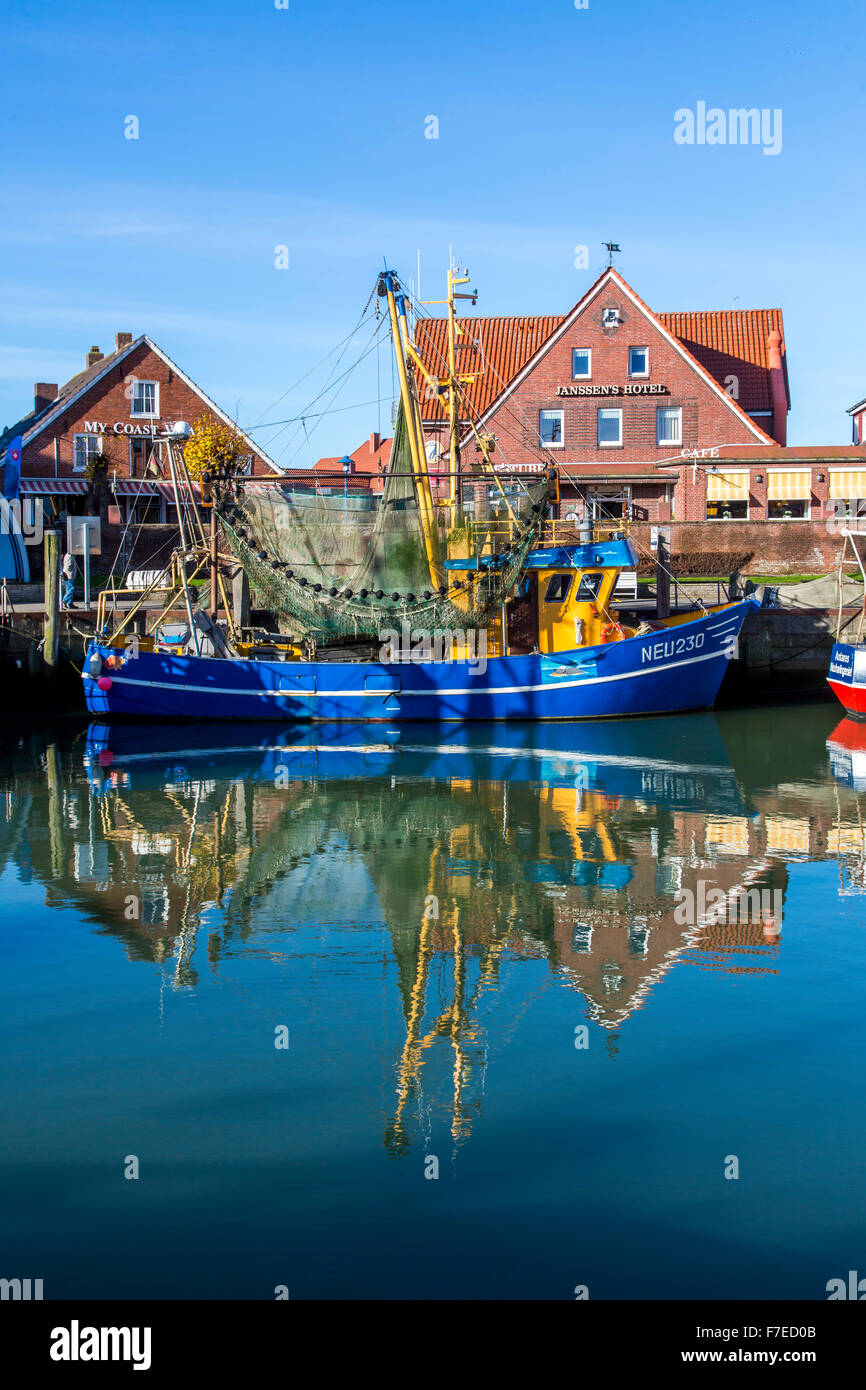 Shrimp trawlers in the small port of Neuharlingersiel, a German North Sea coastal fishing village Stock Photo