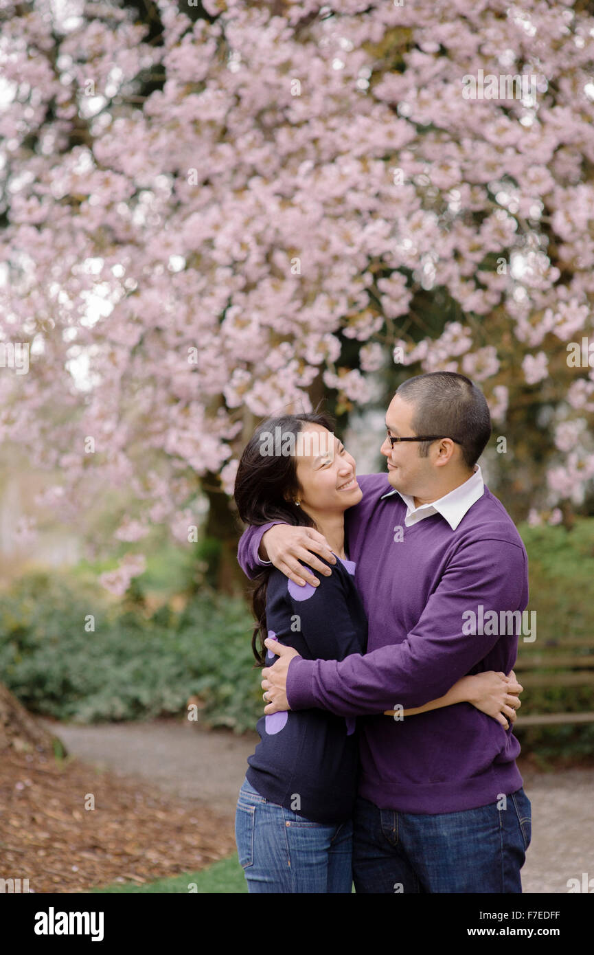 USA, Couple hugging in park Stock Photo - Alamy