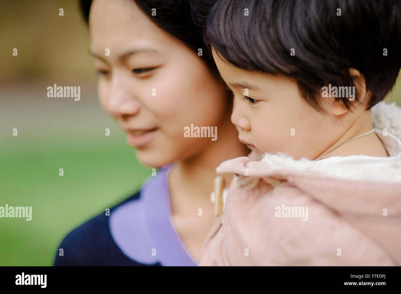 USA, Young woman with daughter (2-3) in park Stock Photo