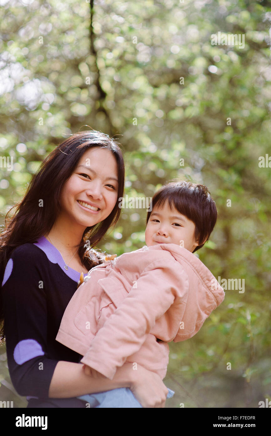 USA, Portrait of mother with daughter (2-3) in park Stock Photo