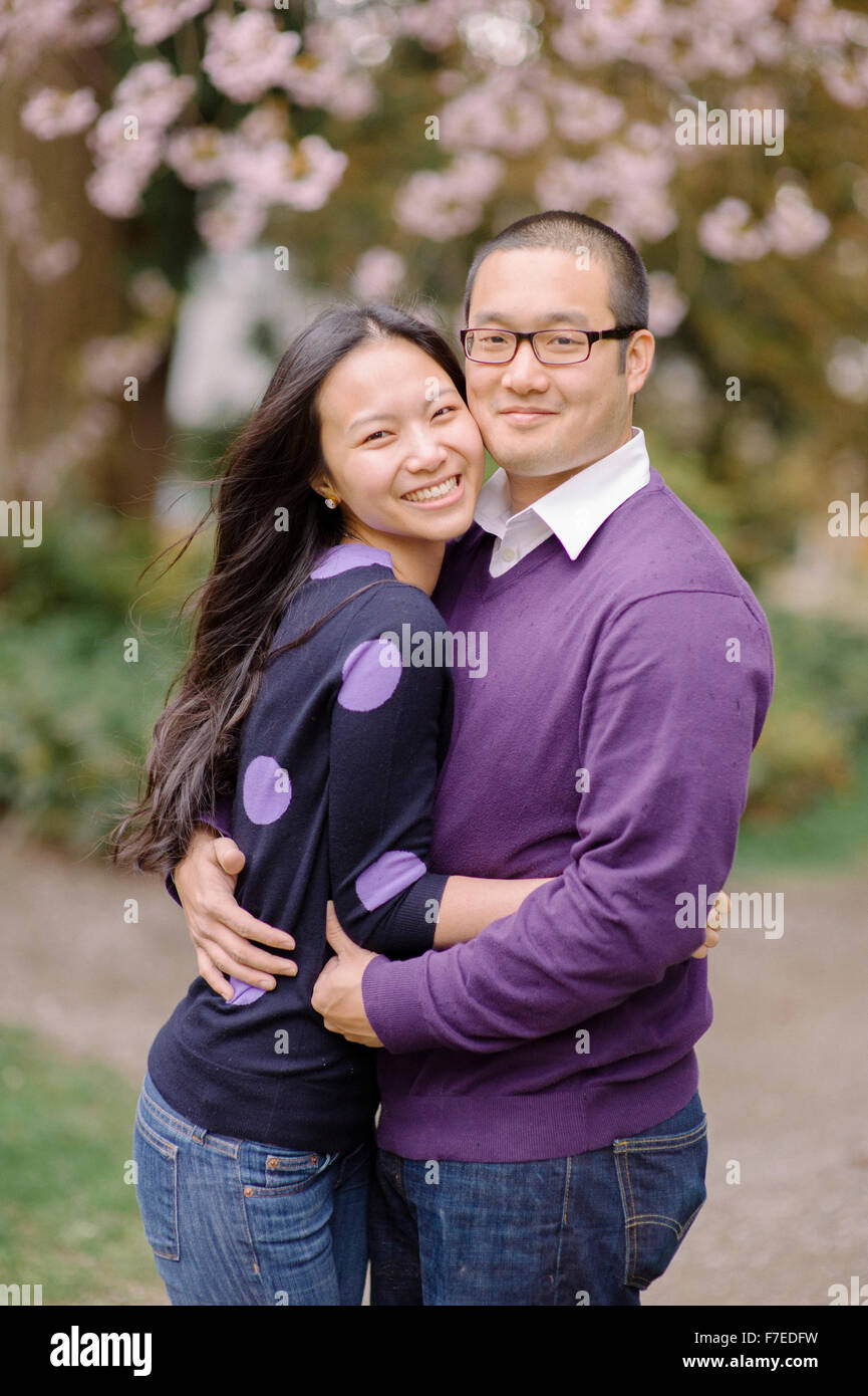 USA, Portrait of couple hugging in park Stock Photo