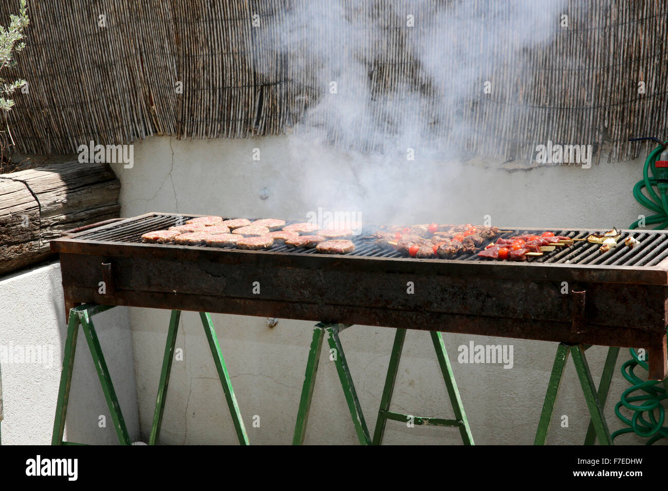 meat cooking on a barbecue now believed to cause cancer Stock Photo Alamy