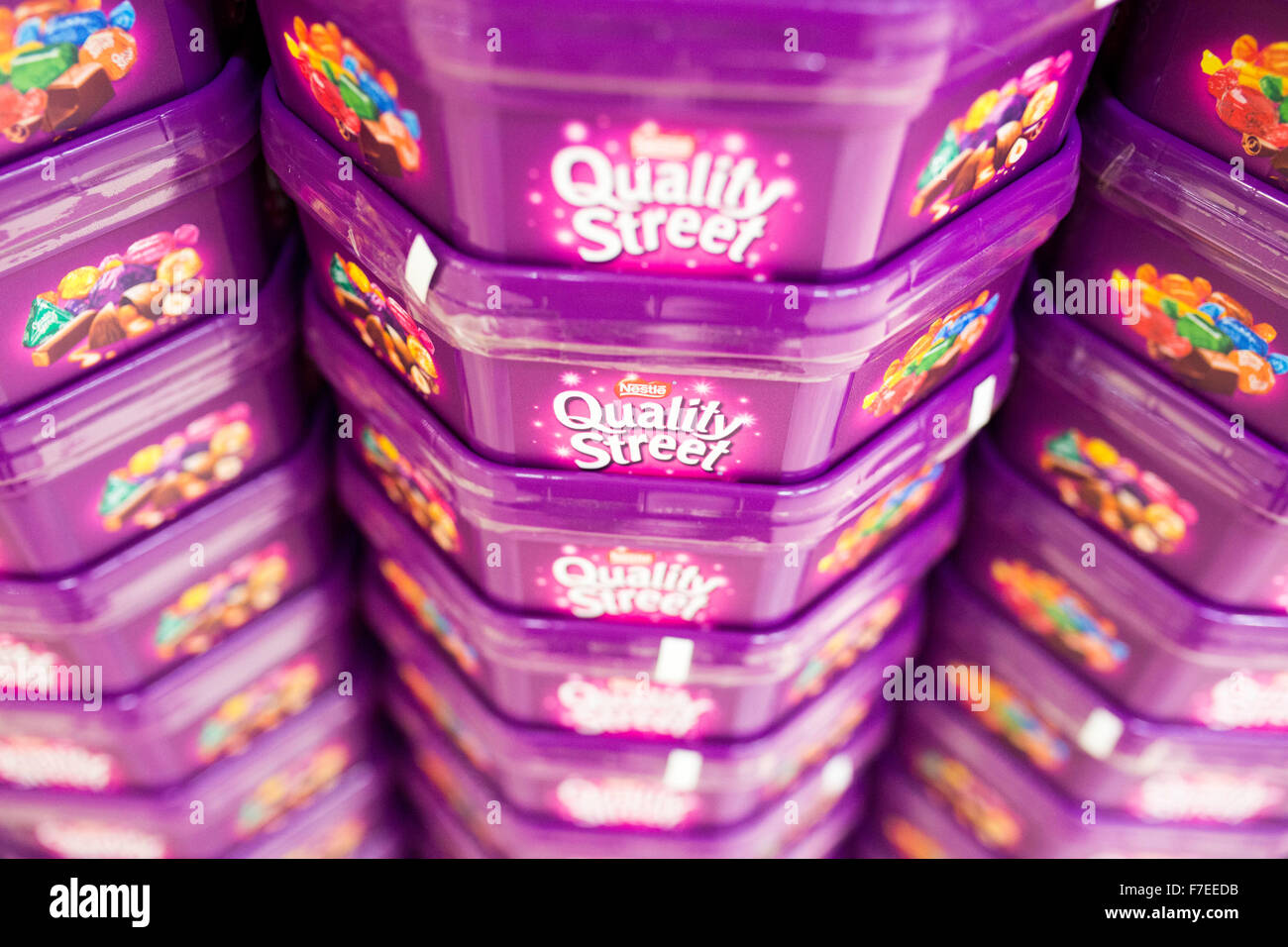 tubs of Quality Street chocolates stacked in a supermarket Stock Photo Alamy