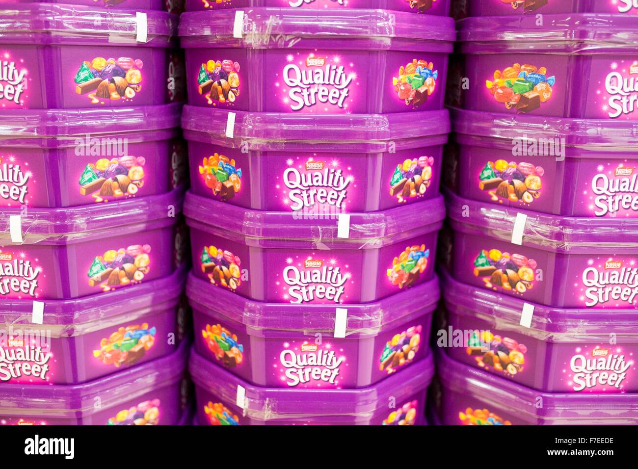 tubs of Quality Street chocolates stacked in a supermarket Stock Photo Alamy
