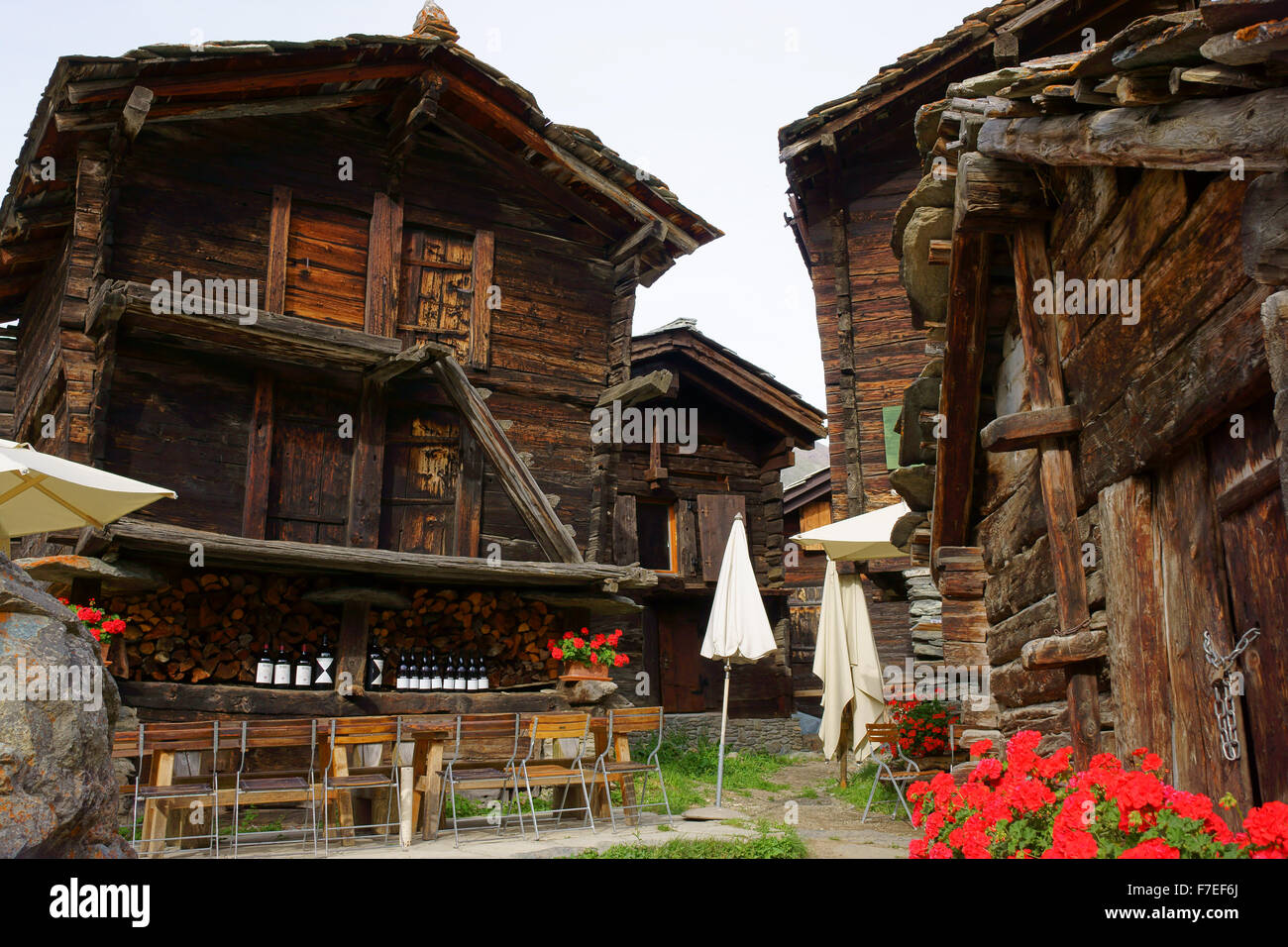 Traditional alpine log houses and barn built from larch tree wood