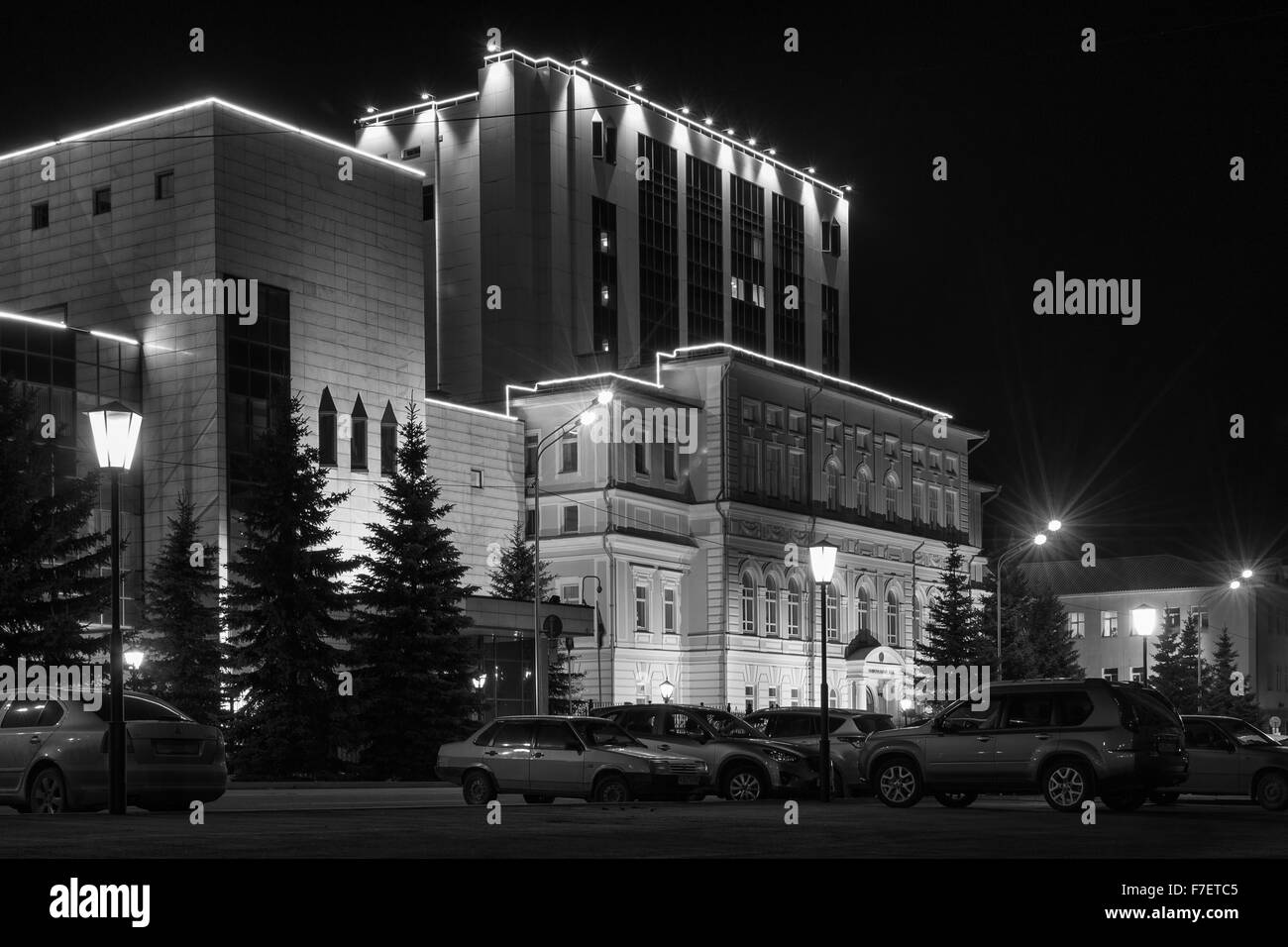 Well lit and bright building illuminated by nightlights in a modern urban  city environment Stock Photo - Alamy