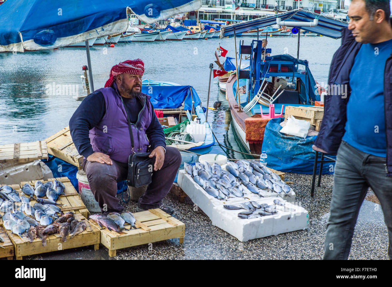 The fish seller: Will someone buy my fish? Stock Photo