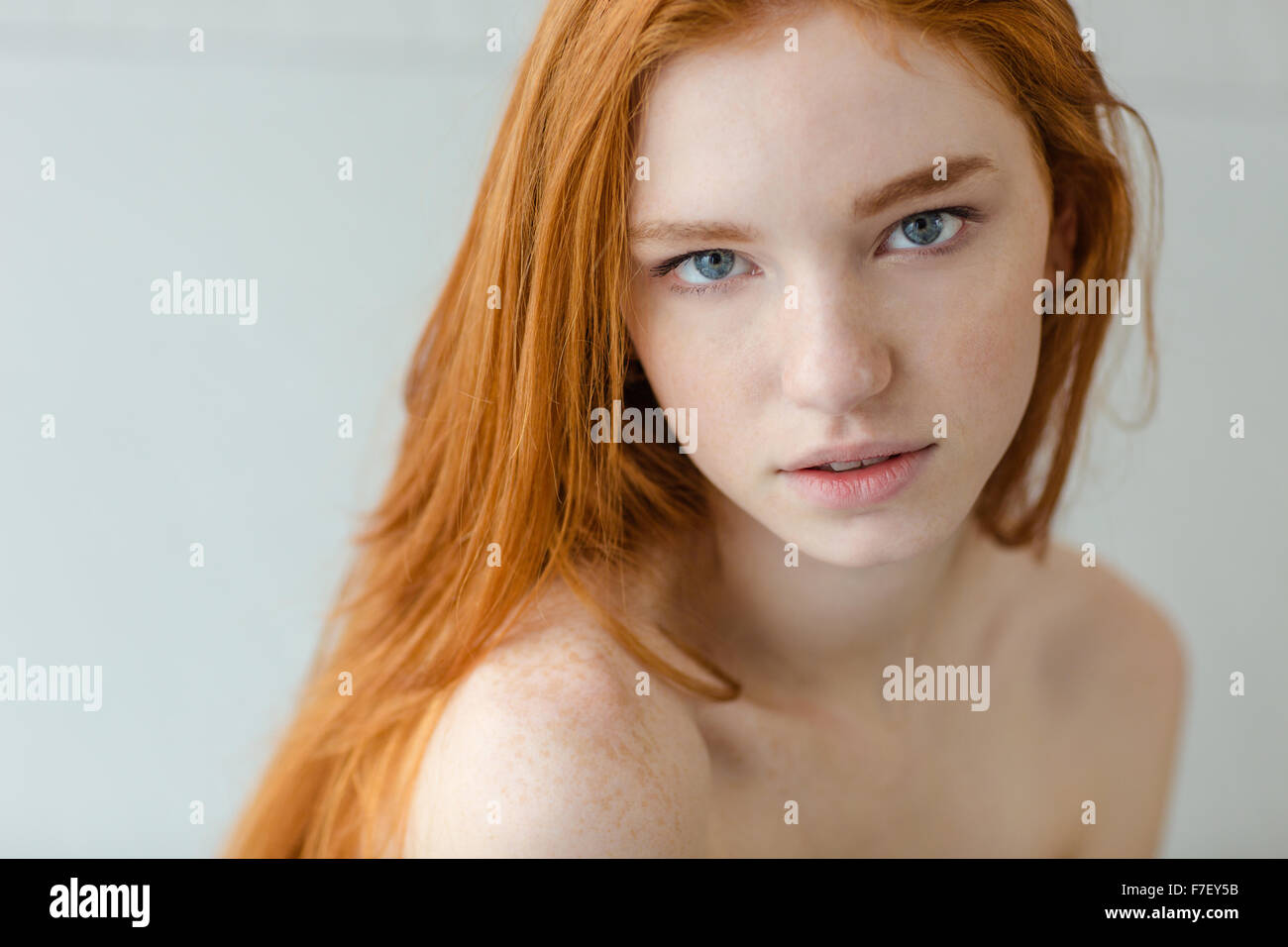 Portrait of attractive redhead woman looking at camera Stock Photo - Alamy