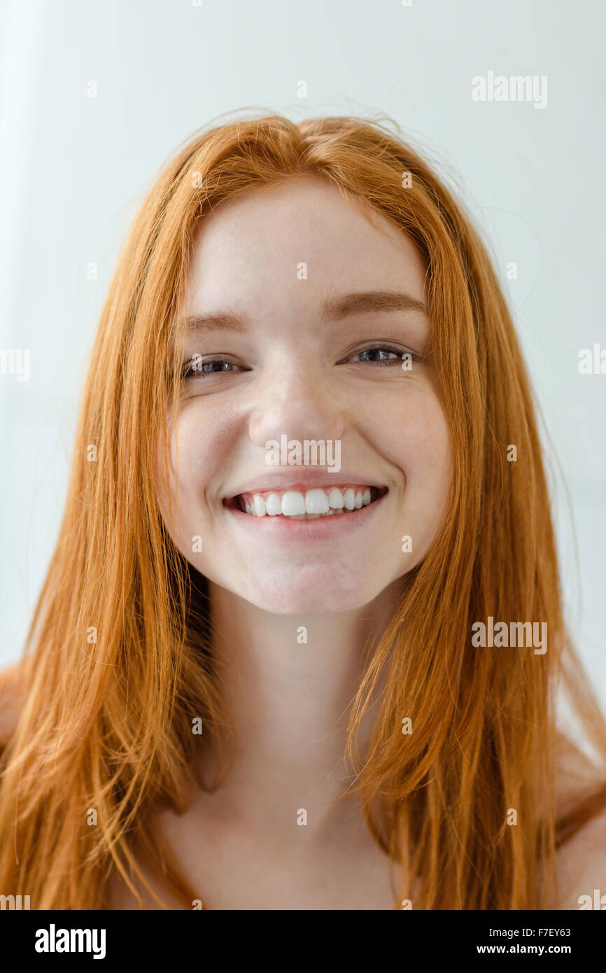 Smiling redhead woman gray hi-res stock photography and images - Alamy
