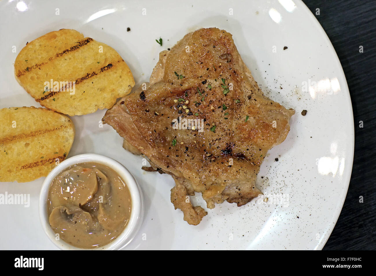 grilled chicken steak with garlic bread Stock Photo Alamy