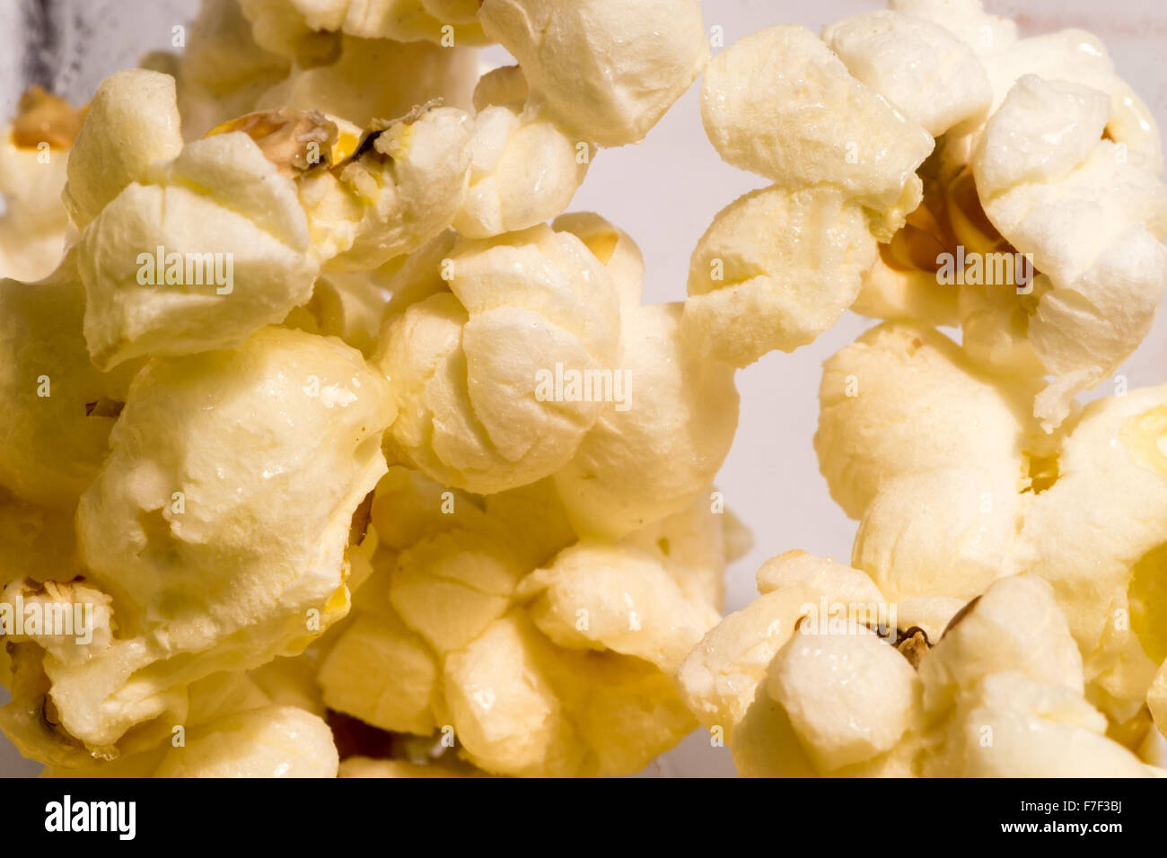 Freshly cooked popcorn in an extreme closeup marco shot showing the hot corn Stock Photo