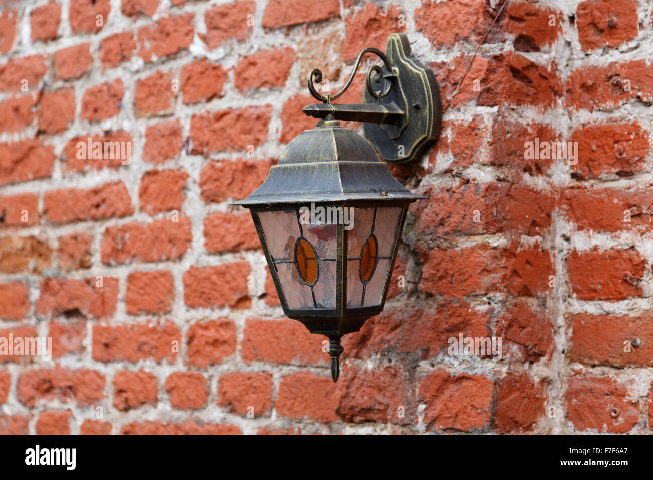 Vintage lantern on old brick wall Stock Photo