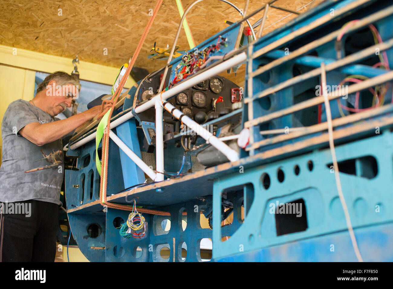 Man building aeroplane in his garage Stock Photo Alamy