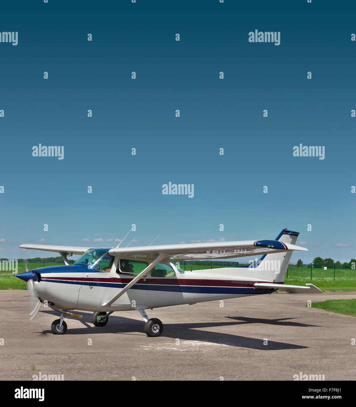 Private small plane preparing for a takeoff on the airfield Stock Photo