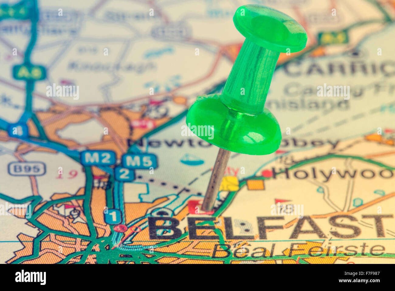 Green pushpin on the Northern Ireland map showing Belfast location Stock Photo