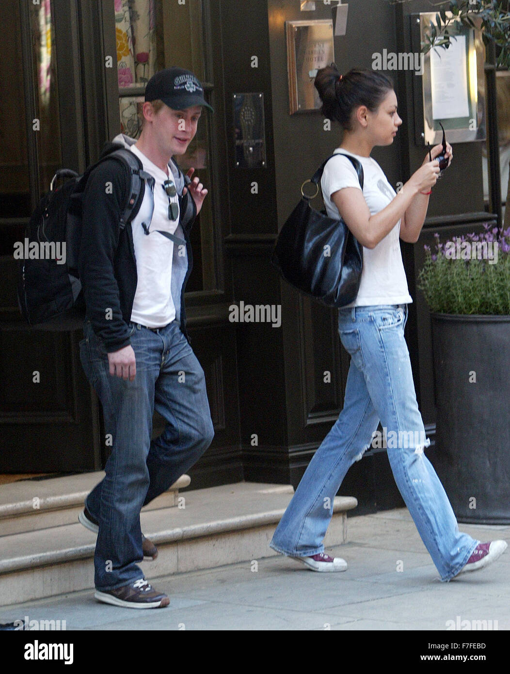 Macaulay Culkin and Girl leaving London Hotel 2006 (credit image©Jack Ludlam)( Stock Photo