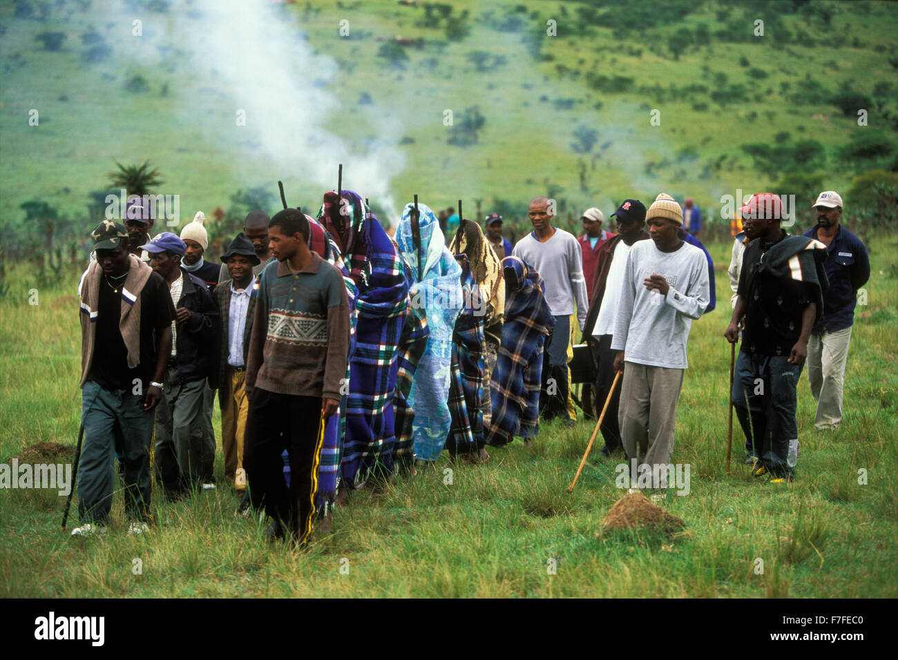 Xhosa male initiates leave an initiation camp, where they have spent  a month in seclusion,  Eastern Cape Province, South Africa Stock Photo