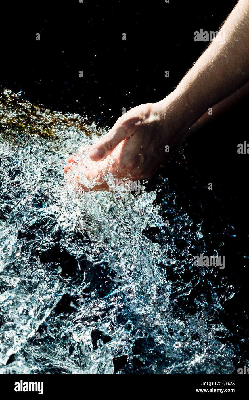 Hands in water Stock Photo - Alamy