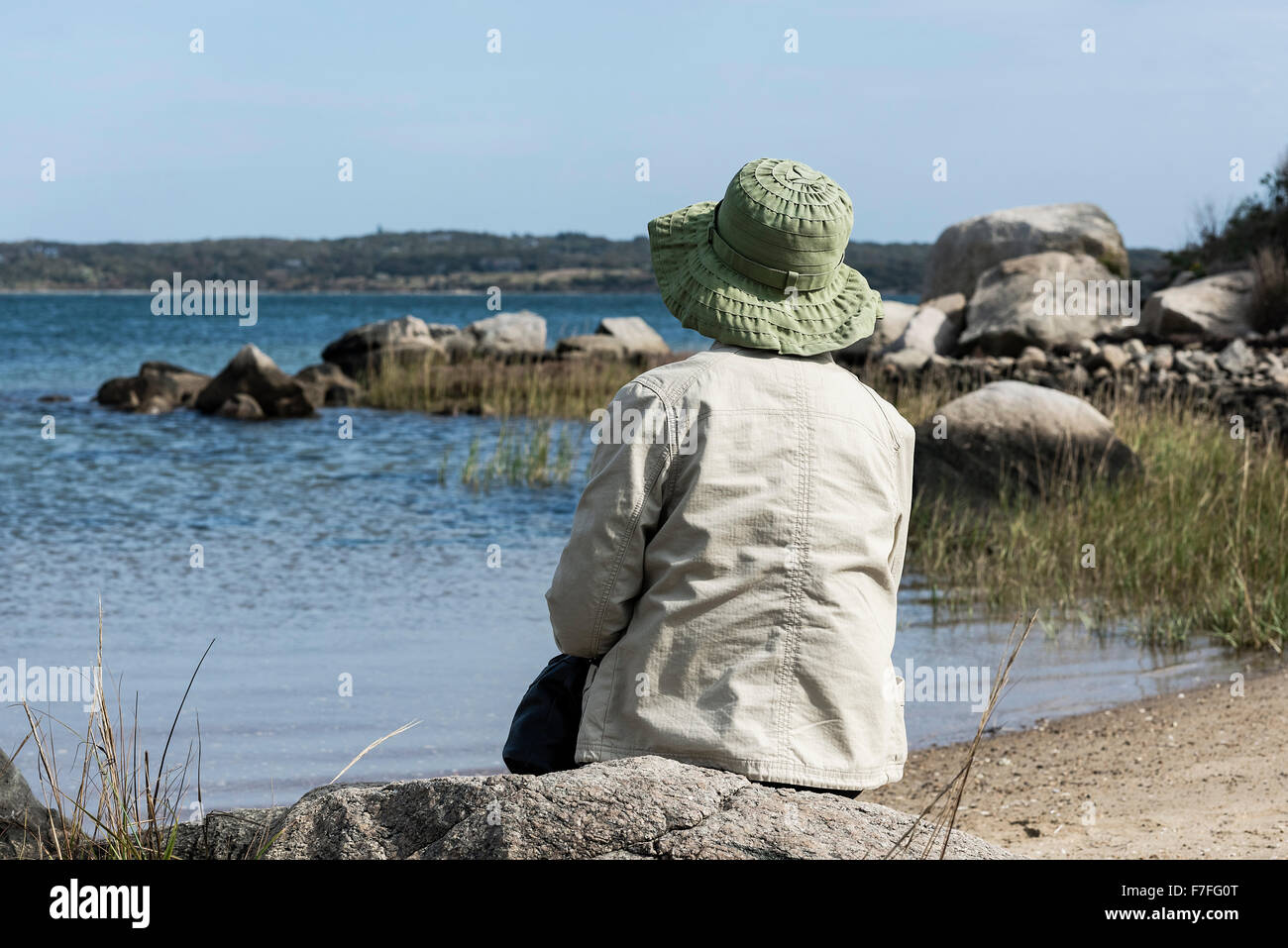 Senior woman enjoys a peaceful coastal view, Martha's Vineyard, Massachusetts, USA Stock Photo