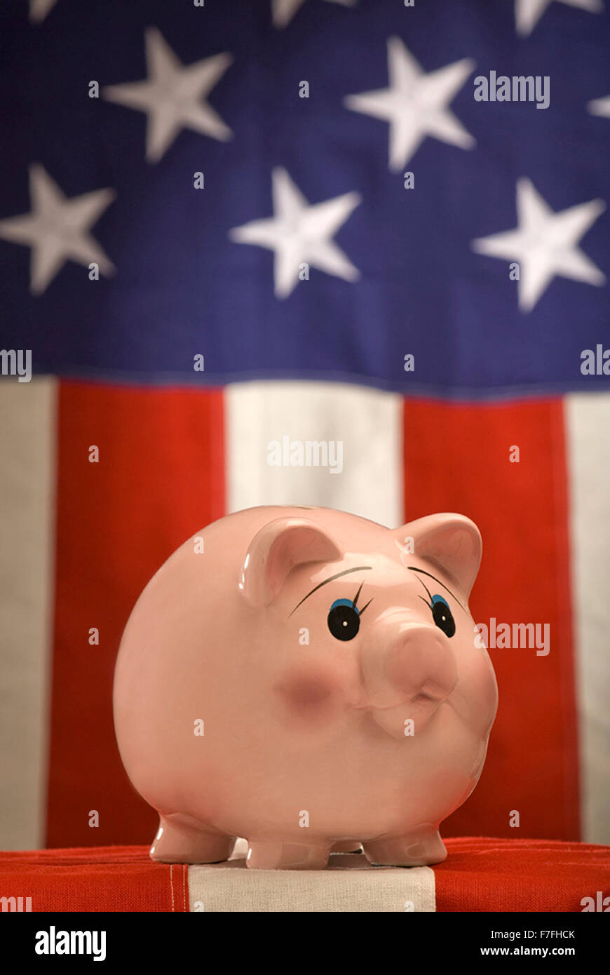 American Piggy Bank on Flag Stock Photo