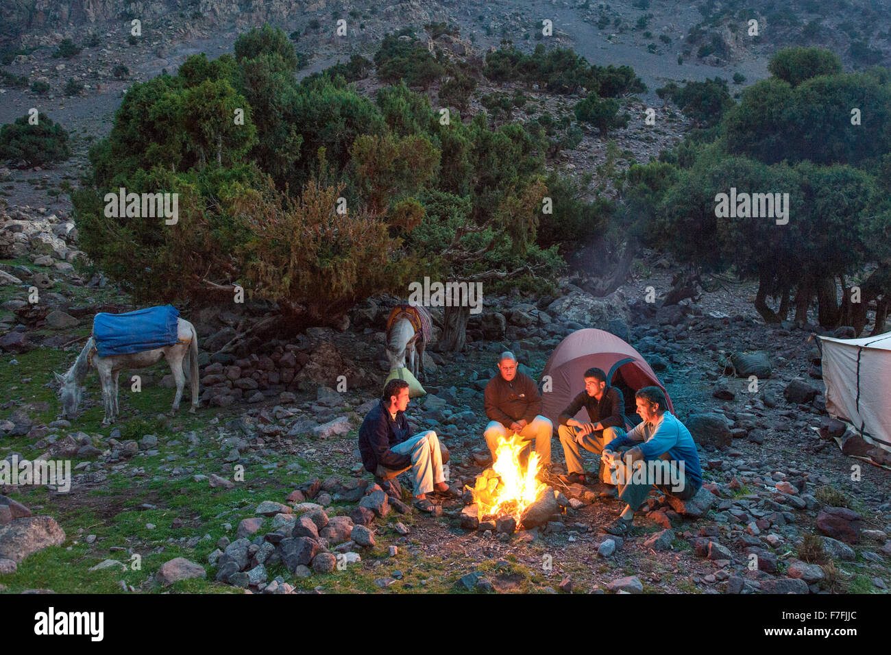 Hikers around a campfire in the Toubkal National Park in the Atlas mountains in Morocco. Stock Photo